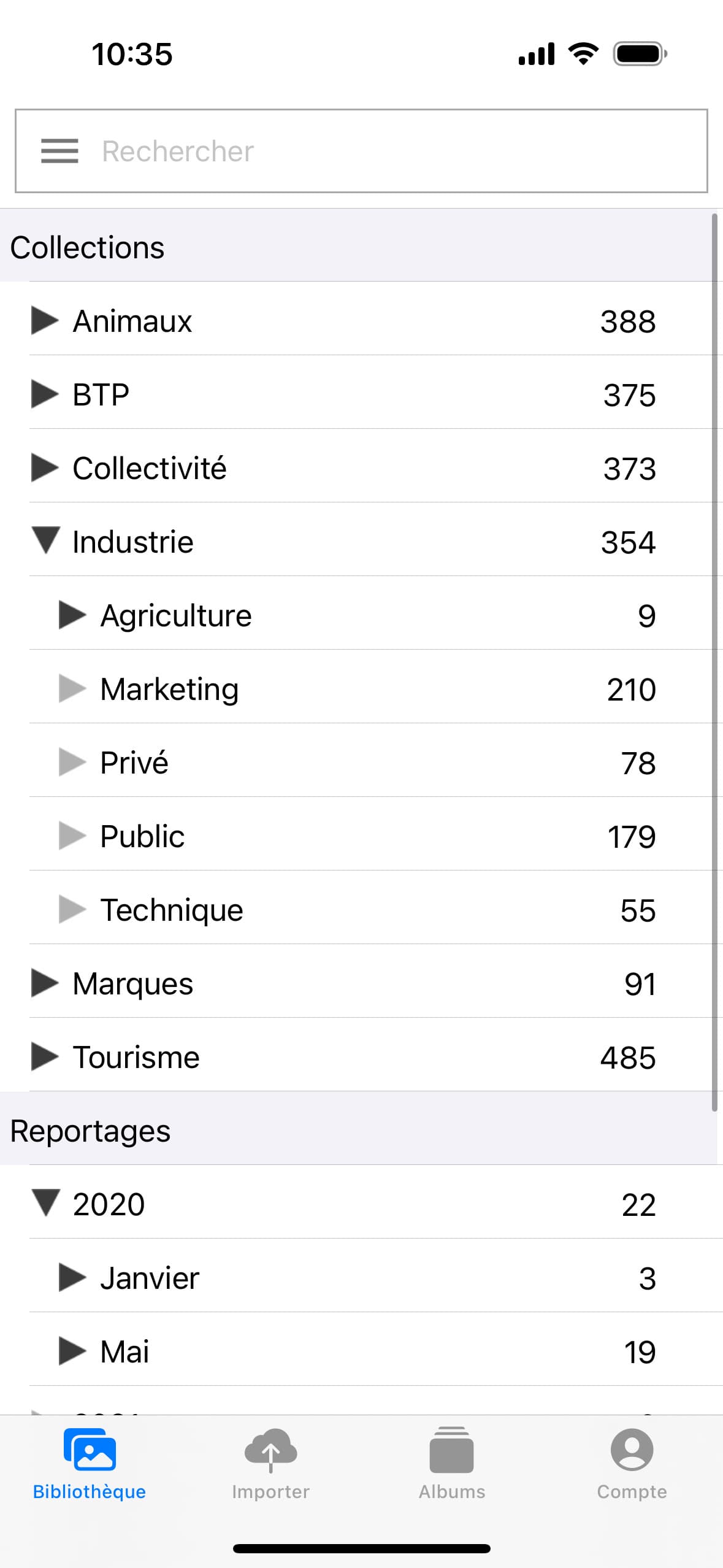 Écran de l'onglet Thesaurus où tous les mots clés sont centralisés de l'application mobile Ephoto Dam.